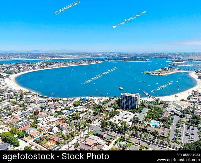 Aerial view of Mission Bay and Pacific Beach in San Diego, California. USA. Community built on a sandbar with villas, sea port and recreational Mission Bay Park