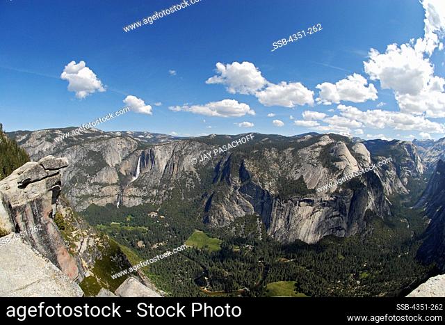 Yosemite National Park, California, with waterfalls Vernal Falls and Nevada Falls tumbling out of a hanging valley to the left, overlooking Yosemite Valley