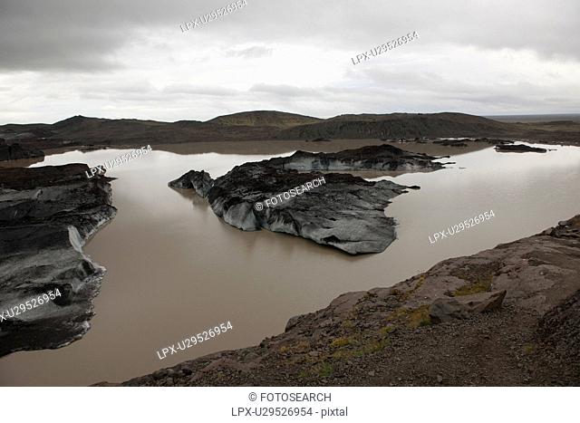 Landscape of dirty melting glaciers in a glacial lake
