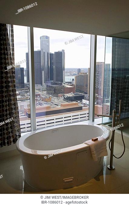 The bathroom in a suite at the Greektown Casino hotel looks out over the Renaissance Center and the Detroit skyline, Detroit, Michigan, USA