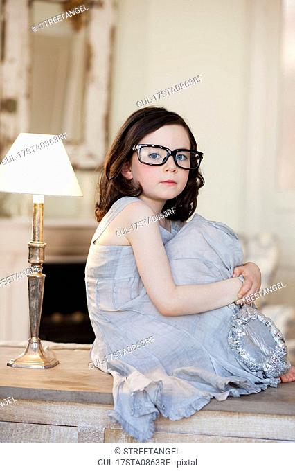 little girl wearing huge pair of glasses