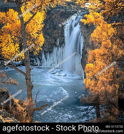 Orchon waterfall surrounded by autumnal coloured trees, Uvurkhangai Province, Mongolia, Asia