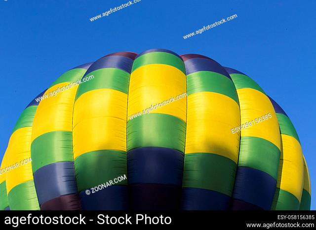 Colorful hot air balloons against a blue sunset sky