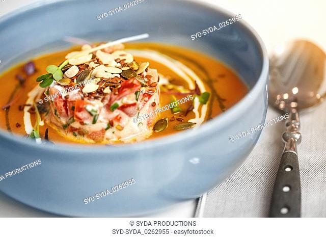 close up of vegetable pumpkin-ginger soup in bowl