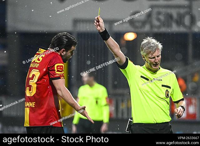 Mechelen's Joachim Van Damme receives a yellow card from referee Christof Dierick during and a soccer match between KV Mechelen and KRC Genk