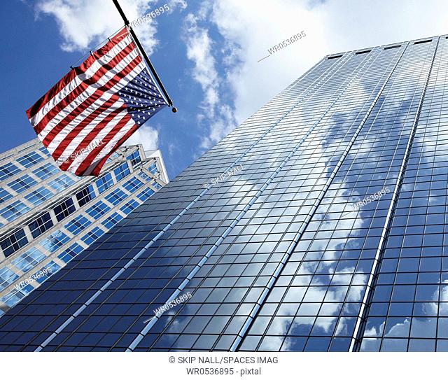 American Flag Against Office Buildings