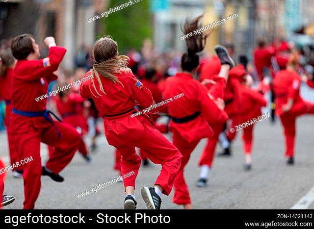 Holland, Michigan, USA - May 11, 2019: Tulip Time Parade, Display by school of martial arts on the street during the parade