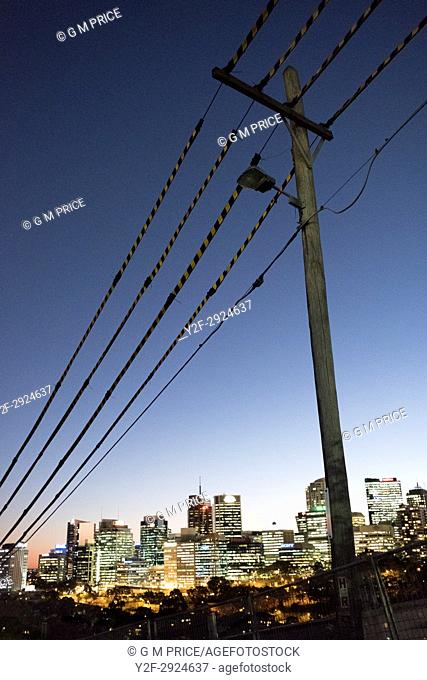 pole and protected power lines with view of North Sydney lights