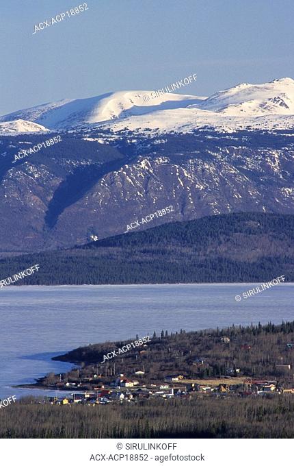 Aerial view of town of Atlin and frozen Lake Atlin, northern British Columbia, Canada