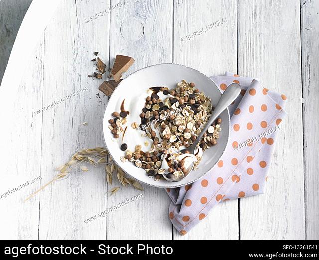 A bowl of chocolate muesli with yoghurt