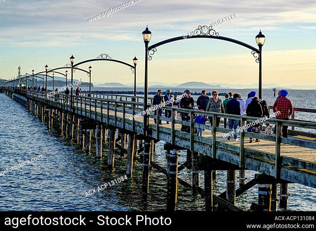 People enjoying a stroll on White Rock Pier, White Rock, British Columbia, Canada