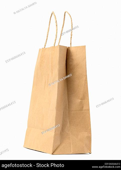 large disposable brown kraft paper bag with handles isolated on white background, eco packaging, zero waste