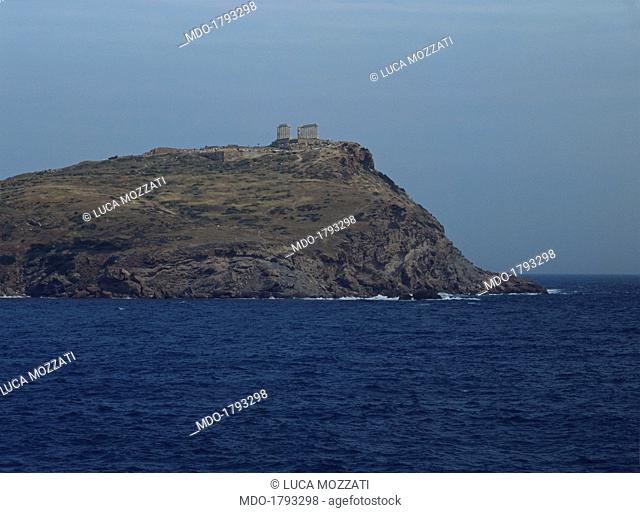 Temple of Poseidon, 440 b.C., 4th Century b.C., marble. Greece, Cape Sounion. Whole artwork view. Distant view from the west, with an outcrop of rock and sea