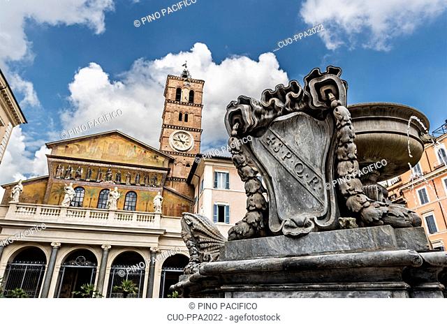 Baroque fountain of Bramante and church of Santa Maria in Trastevere, Piazza Santa Maria in Trastevere square, district of Trastevere, Rome, Lazio, Italy