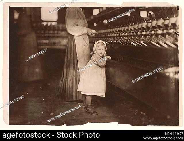 Ivey Mill, Hickory, N.C. Little one, 3 years old, who visits and plays in the mill. Daughter of the overseer. Artist: Lewis Hine (American