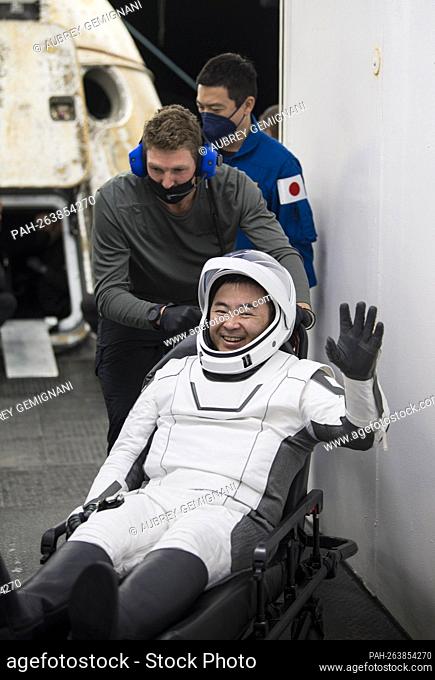 Japan Aerospace Exploration Agency (JAXA) astronaut Aki Hoshide waves after being helped out of the SpaceX Crew Dragon Endeavour spacecraft onboard the SpaceX...