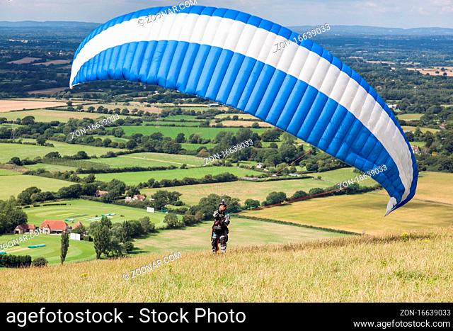 DEVILS DYKE, BRIGHTON/SUSSEX - JULY 22 : Paragliding at Devil's Dyke near Brighton on July 22, 2011. Unidentified person
