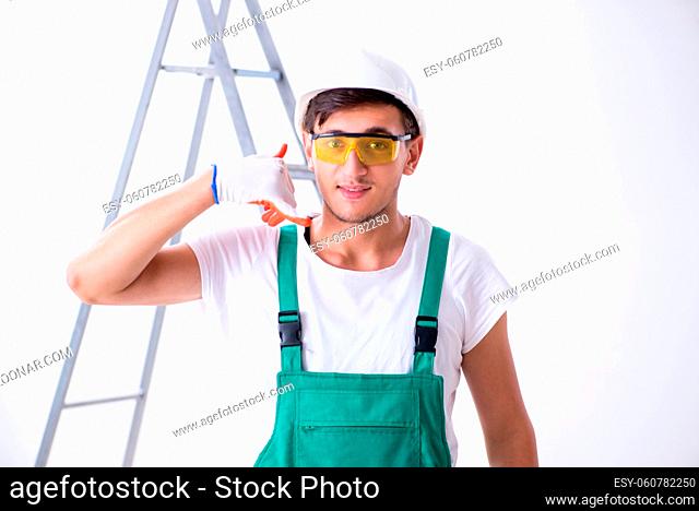 Young worker with protective equipment in safety concept