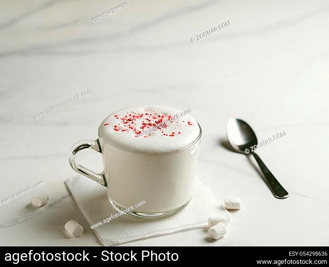 Babyccino - whipped milk or cream and candy sprinkles. Drink for kids idea and recipe - babyccino is warm whipped milk, without coffee, without sugar