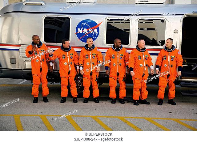 CAPE CANAVERAL, Fla. - At NASA's Kennedy Space Center in Florida, the astronauts on the STS-129 crew, dressed in their orange launch-and-entry suits