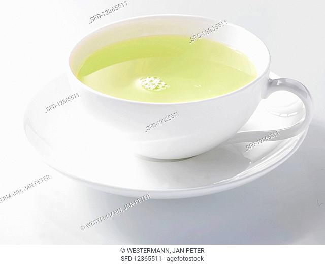 Green tea in a white porcelain cup