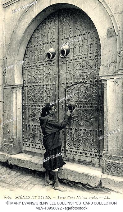 An absolutely fabulous Arab Doorway in the port town of Sidi Bou Said Tunisia, with a pair of knockers for the main decorated wooden doors (for ease of knocking...