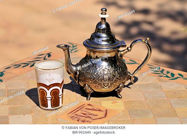 Silver teapot and tea glass with peppermint tea, Menara Gardens, Marrakech, Morocco, Africa