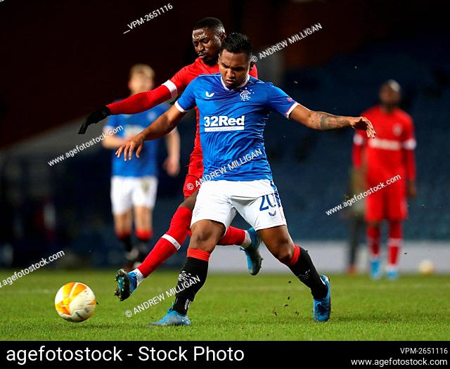 Royal Antwerp's Martin Hongla (left) and Rangers' Alfredo Morelos battle for the ball during the UEFA Europa League match at the Ibrox Stadium, Glasgow