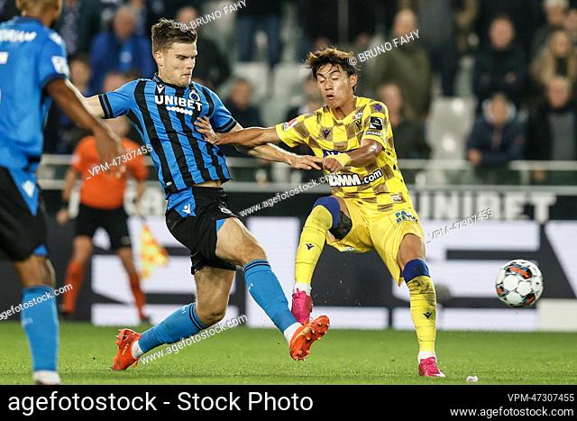 Club's Bjorn Meijer and STVV's Daichi Hayashi fight for the ball during a soccer match between Club Brugge KV and Sint-Truidense VV
