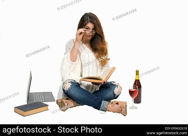 Beautiful young woman reading an interesting book