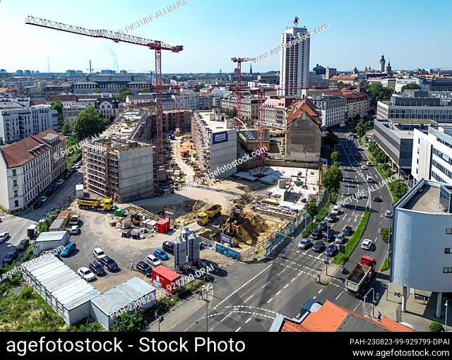 23 August 2023, Saxony, Leipzig: Several cranes are on the construction site of the Krystallpalast area (aerial view with drone)