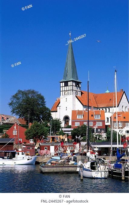 Boats on harbor with church in background, Ronne, Bornholm, Denmark