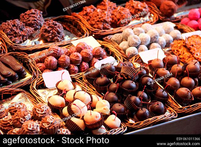 Sweet chocolate candy market .Confectionery at Boqueria market place in Barcelona, Spain. Assorted chocolate candy shop with variation of candies