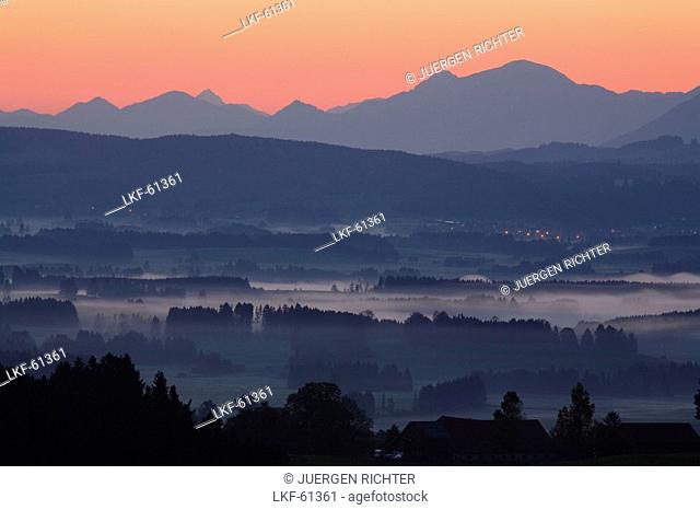 View from Auerberg at sunrise, near Bernbeuren, Allgaeu, Upper Bavaria, Bavaria, Germany