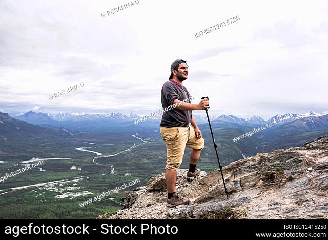 USA, Alaska, Smiling hiker on mountain top in Denali National Park