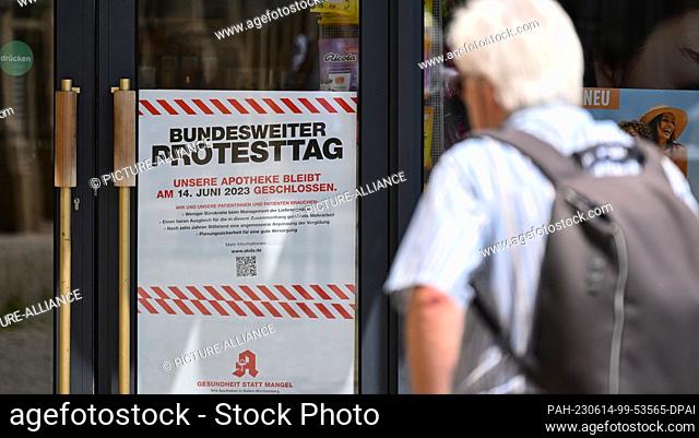 14 June 2023, Baden-Württemberg, Stuttgart: Protest posters hang outside the closed Solitude pharmacy in Stuttgart. Many pharmacies are to remain closed in...