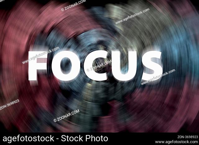 Focus word with motion rays on a blurred chalkboard background Focus word with motion rays on a blurred chalkboard background