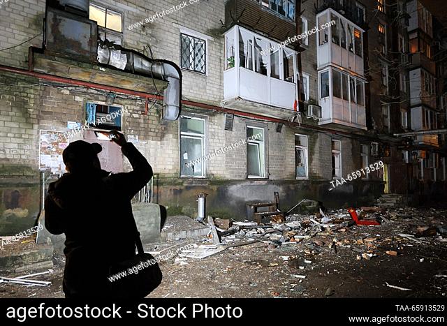 RUSSIA, DONETSK - DECEMBER 19, 2023: A man is seen by a building damaged in shelling in the Kiyevsky neighbourhood. Dmitry Yagodkin/TASS