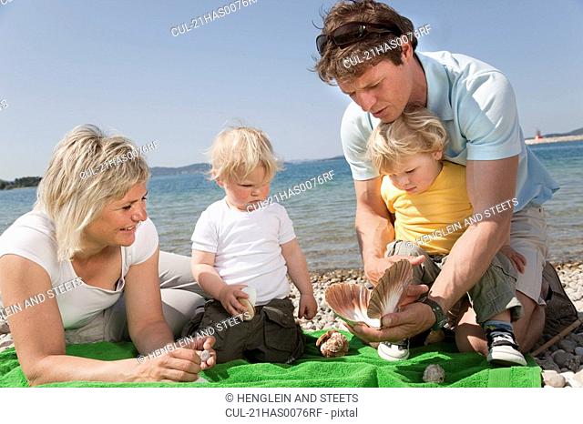 Family with twins at the beach