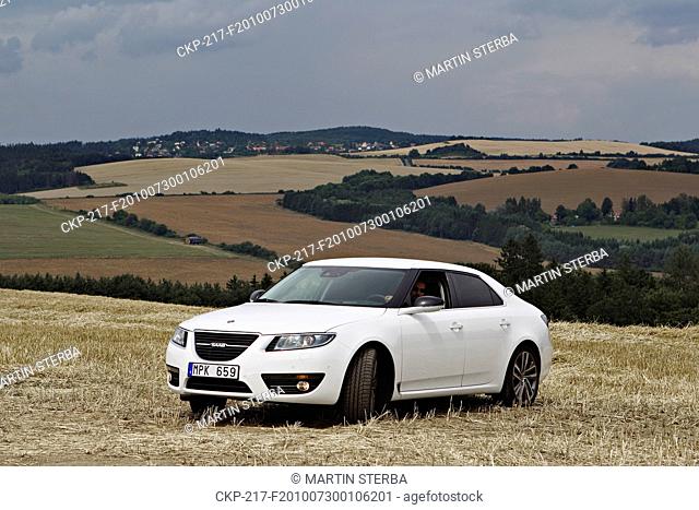 The first car Saab 9-5 Vector TiD4 Sedan in Czech Republic, a new luxury limousine of Swedish carmaker Saab, speeds is seen near Czech town Chocerady