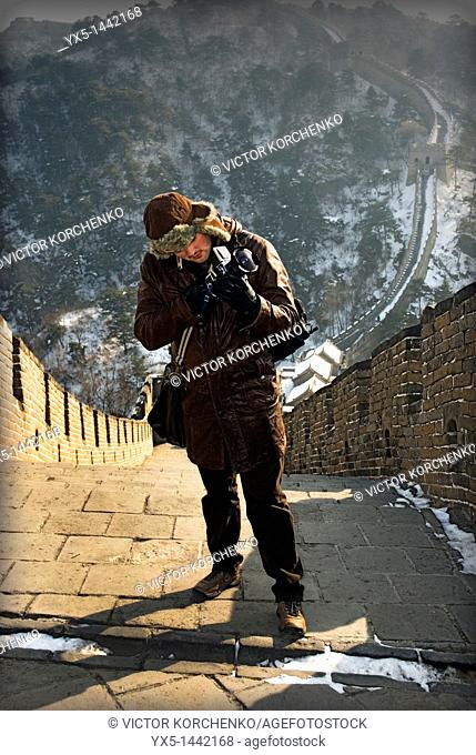Tourist photographer on Great Wall of China at Mutianyu