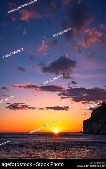 Beautiful sunset over the cliffs in Petrovac coast, Montenegro