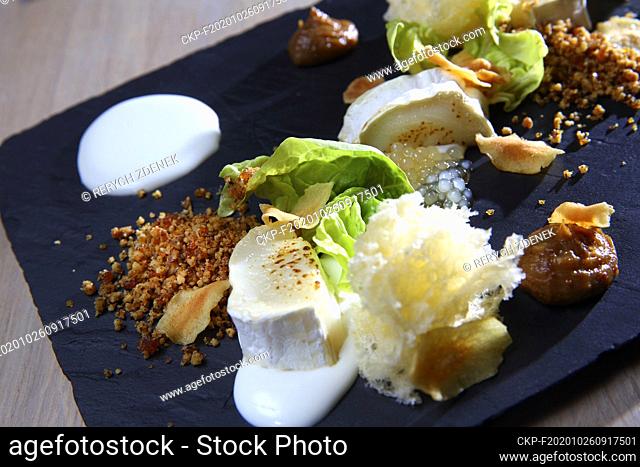 Gratinated (Baked, Grilled) Goat Cheese, fig jam, cheese, honey caviar, plate in Prague, Czech Republic, October 18, 2017. (CTK Photo/Zdenek Rerych)