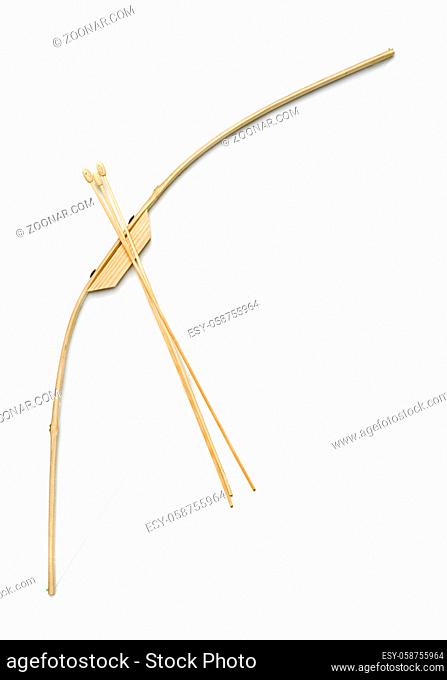 Toy wooden bow and arrows isolated on white