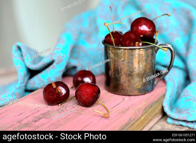 Sweet cherry in the Tin ancient mug
