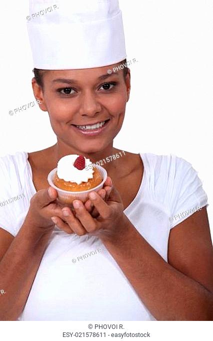 Chef showing off a cupcake