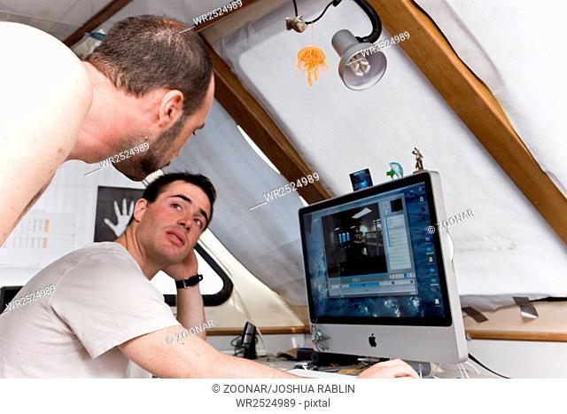 Crew working on an onboard computer
