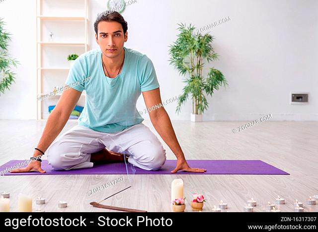 Man during yoga session at home