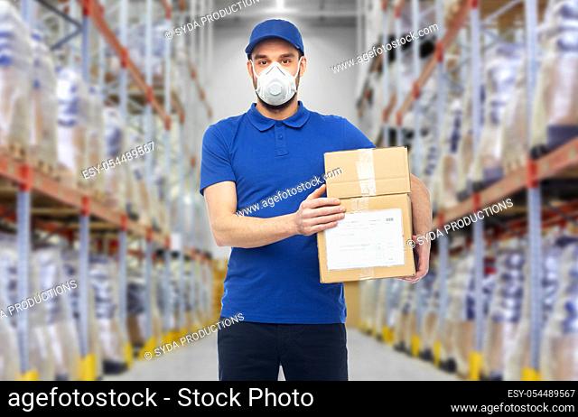 delivery man in mask or respirator at warehouse