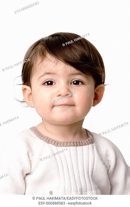 Face of a cute adorable baby infant toddler with innocent expression, isolated